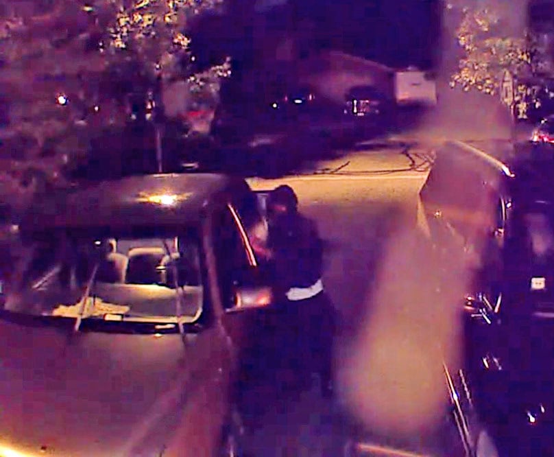 Video footage taken early Thursday morning, Aug. 27, captures a hooded figure
leaving after searching two vehicles. Another man can be spotted walking down the road later in the footage.
