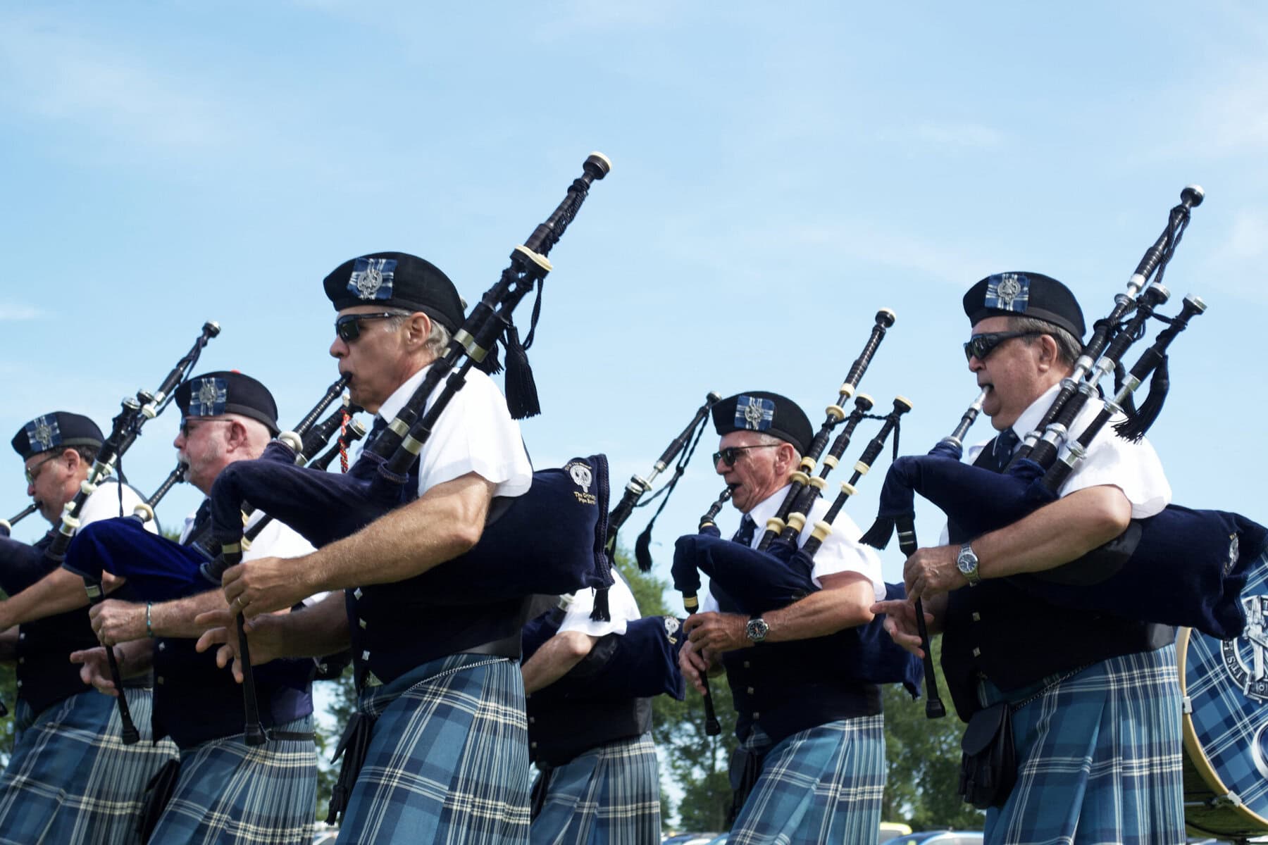 The Grimsby Pipe Band treats guests to a bagpipe performance before the first polo match began.