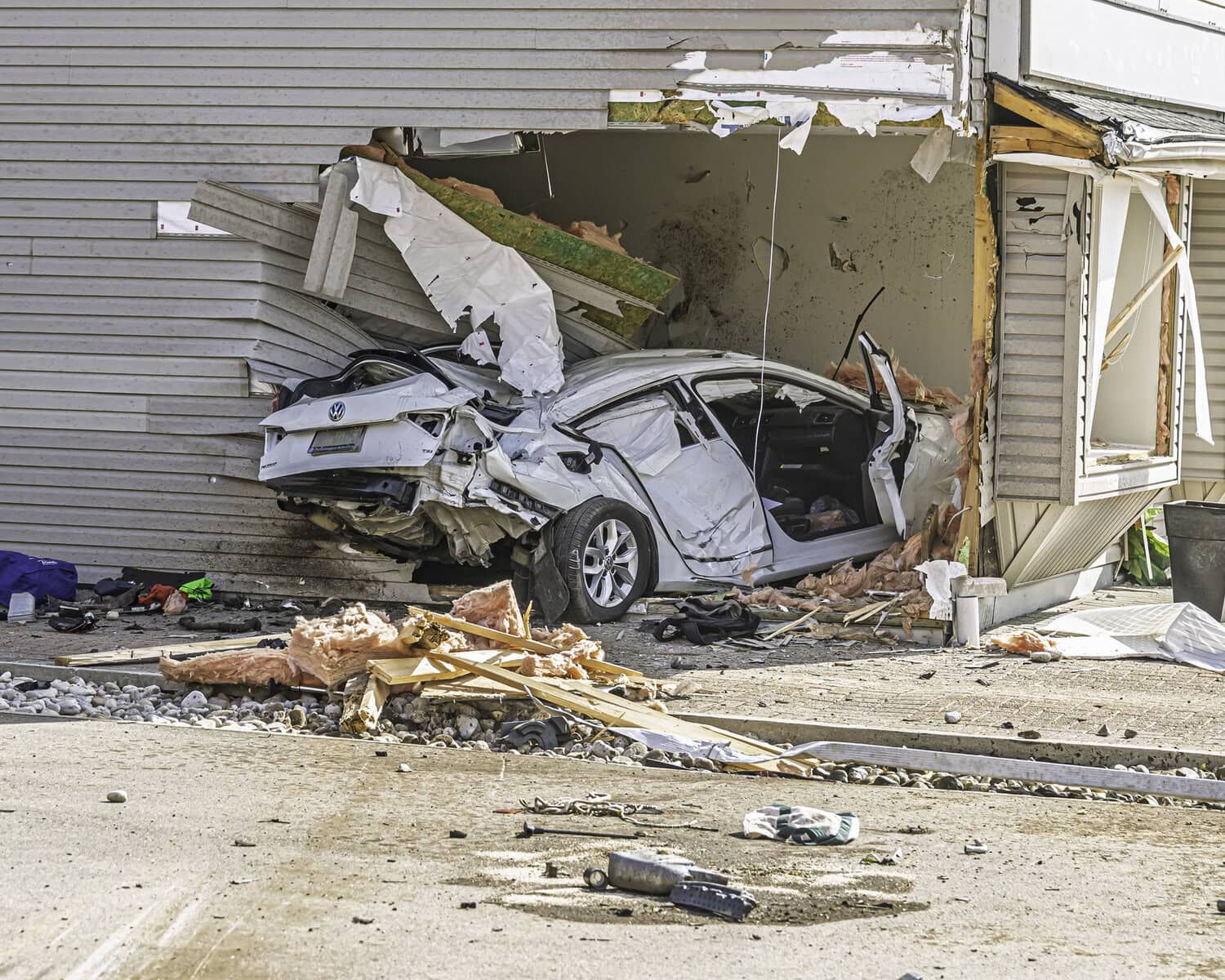 The impact left the vehicle crushed into the side of the mixed-use building, which houses travel agency Upper Canada Travel on the lower right, Budapest Bakeshop’s office on the lower left and three apartments upstairs.