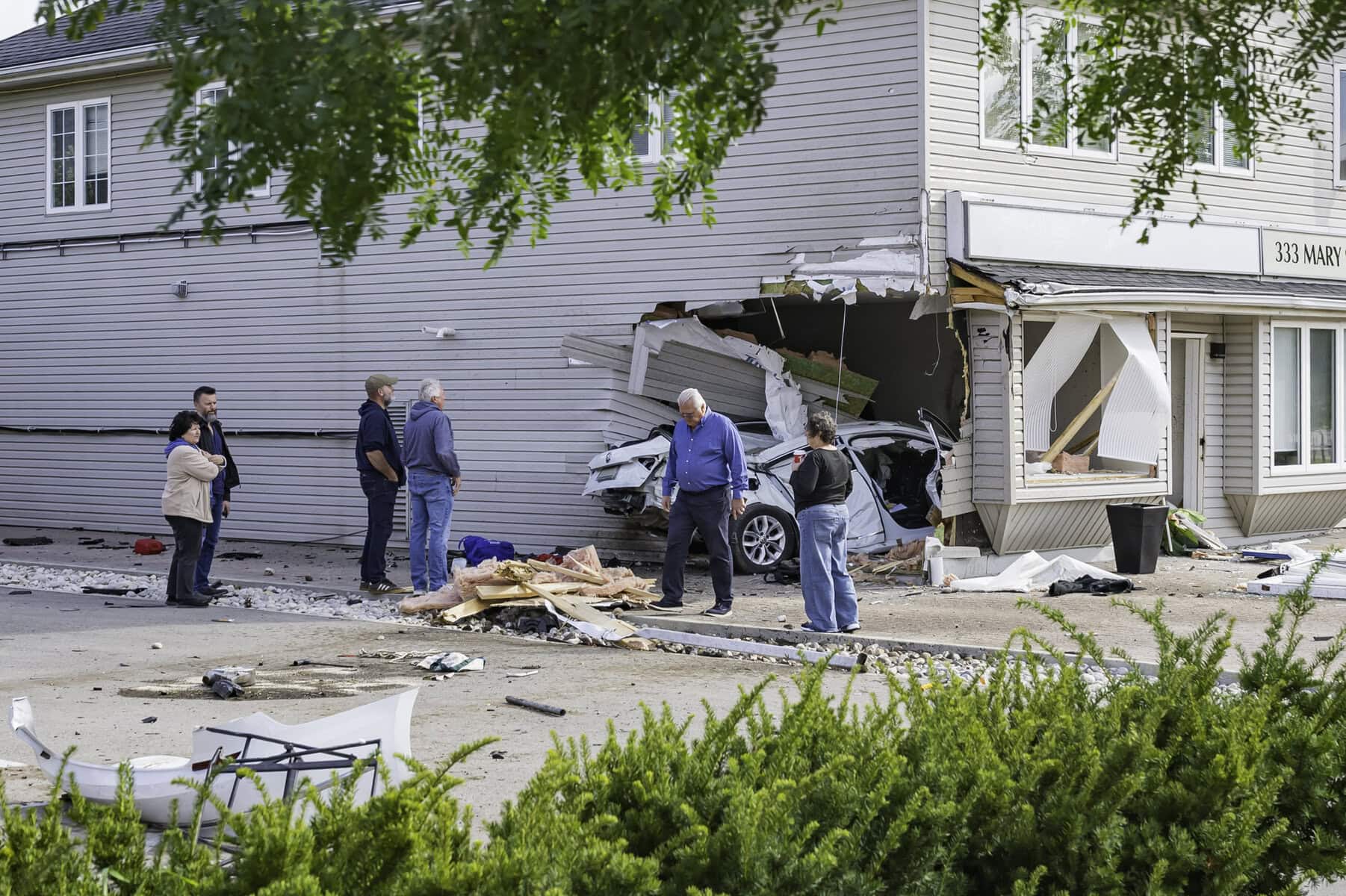 Those in the neighbourhood take stock of the damage to 333 Mary St. Building co-owner Nadja Lepere said Lepere said one of the tenants called her shortly after the crash, bringing her to the scene. “It’s like a movie, you know,” she said.