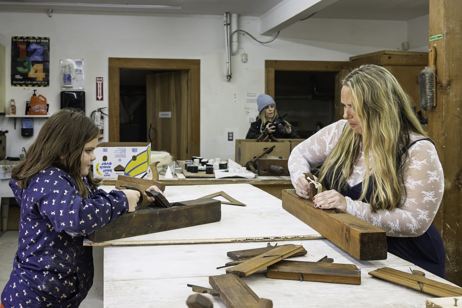 At Willowbank, Saxon Evan teaches seven-year-old Olivia Rowan how wooden planes are used. The school of restoration arts provides instructions on the ins and outs of restoring heritage properties, including  through hands-on experience.