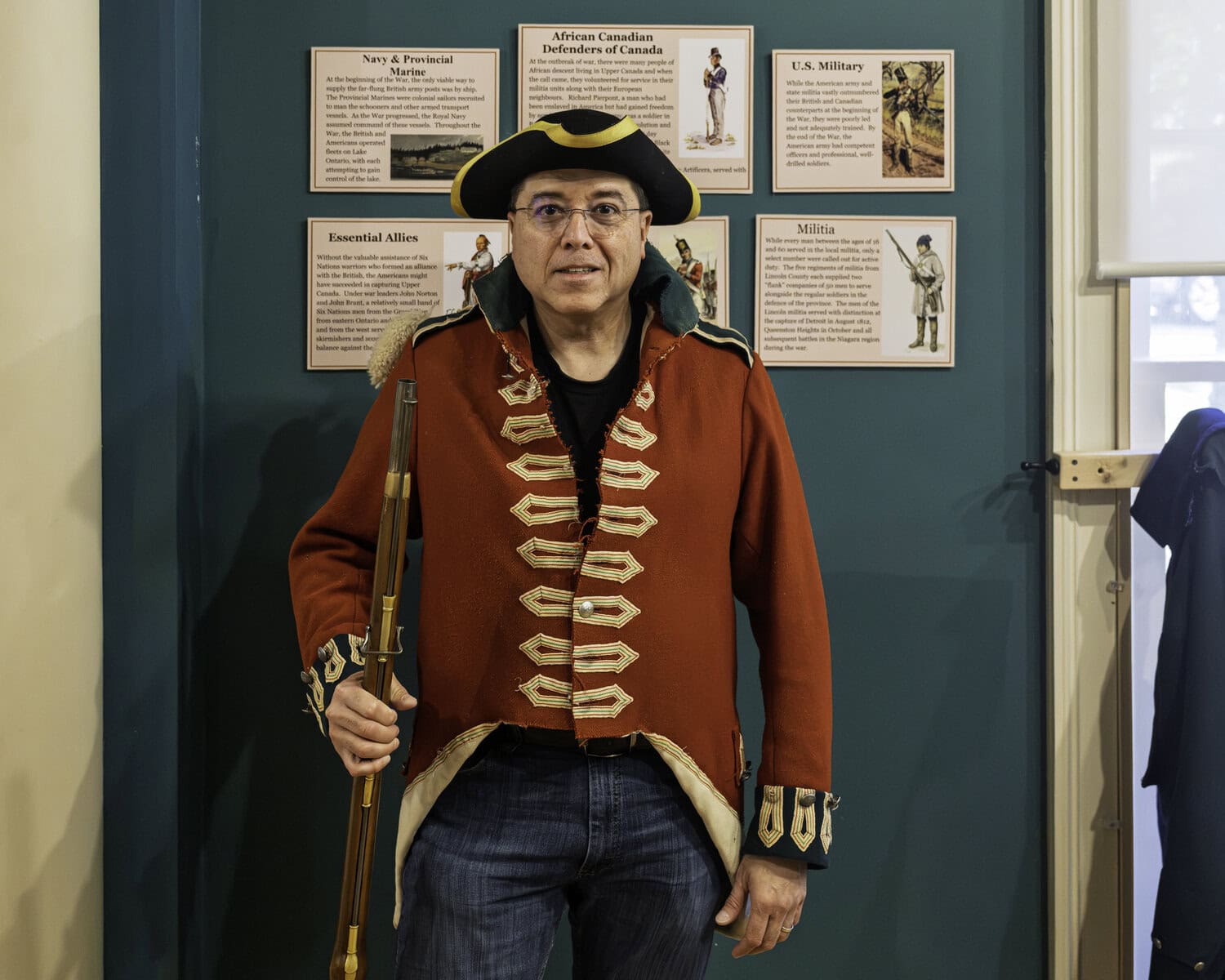 At the Niagara-on-the-Lake Museum, Diego Gomez tries on a typical War of 1812 uniform, worn by the infantry of the British Army.
