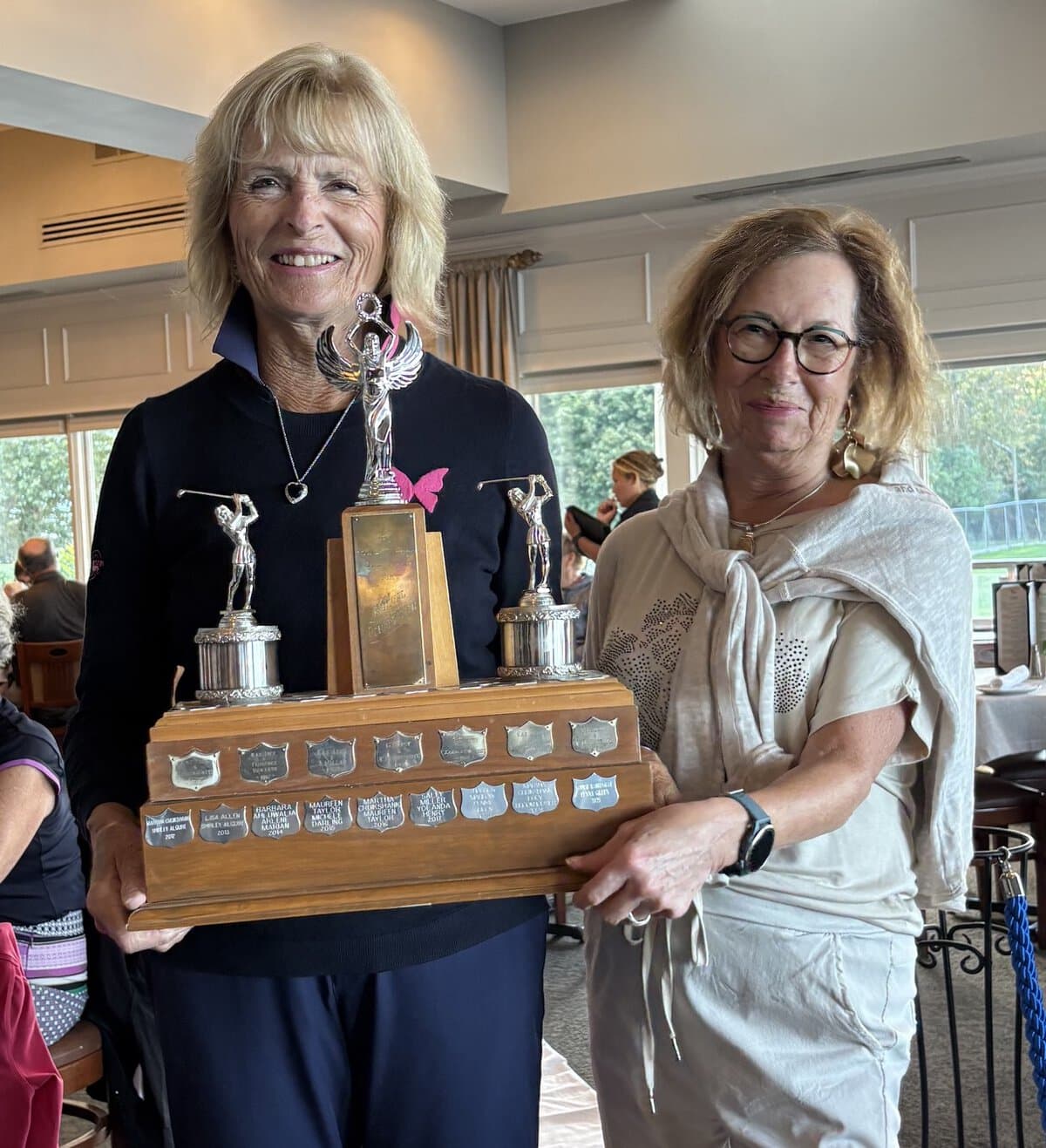 Martha Cruikshank, left, of the 18-hole league, and Deborah Williams of the nine-hole league, teamed up to win the Yule Pairs championship. 