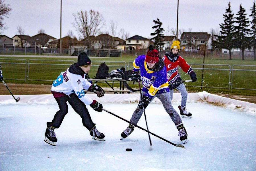 Canadian_kids_will_be_Canadian_kids_as_a_group_of_teens_took_to_the_Virgil_community_rink_to_play_some_hockey_against_the_rules._Evan_Saunders_5