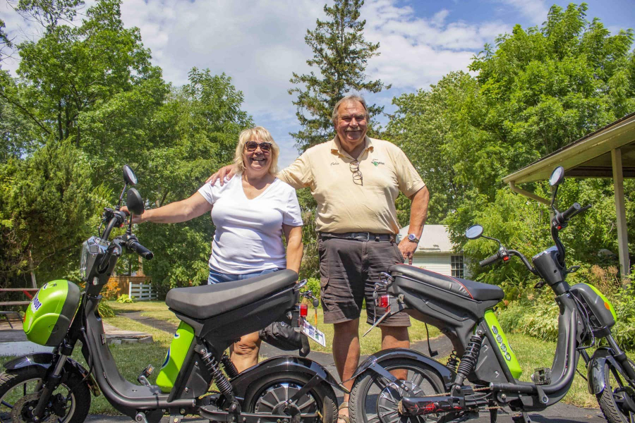 Jennifer Elliot (left), and Colin Telfer, standing in front of their e-bikes at E-Skoot.