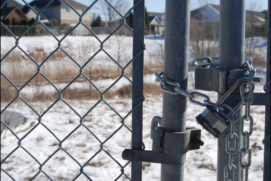 Locked_gate_to_town_property_where_storm_water_pond_is_located_Brittany_Carter