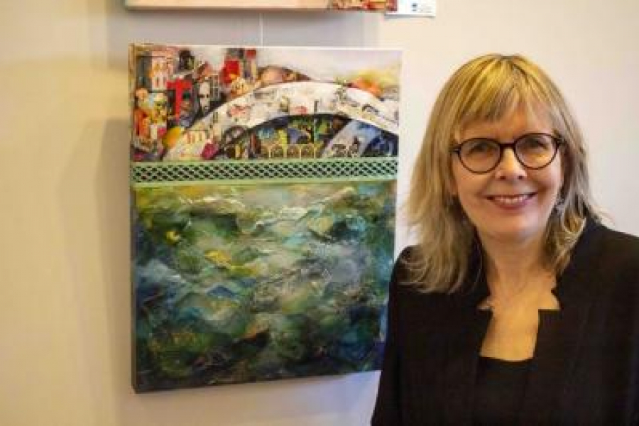 Lynne_Gaetz_with_one_of_her_painting_on_display_now_at_the_Pumphouse_Art_Centre._(Evan_Saunders)