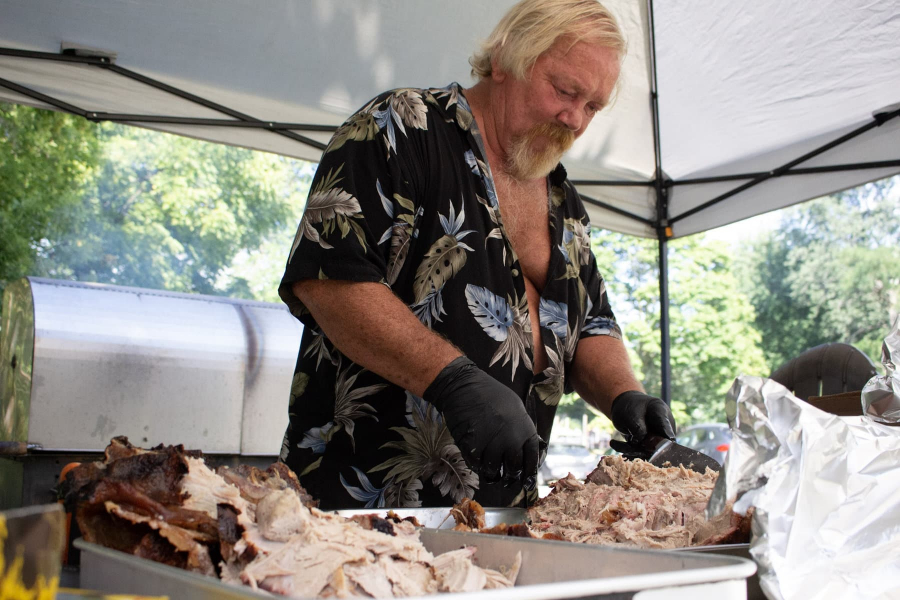 Calvin House prepares the roasted pig.