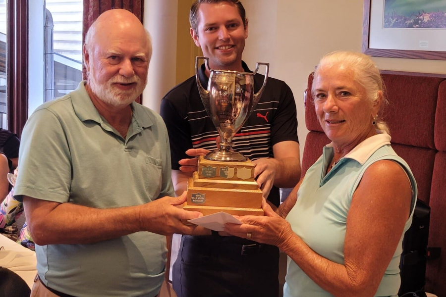 NOTL Golf Club pro Keith Vant presents Bernard and Sharron Marlow with the Matrimonial Cup.