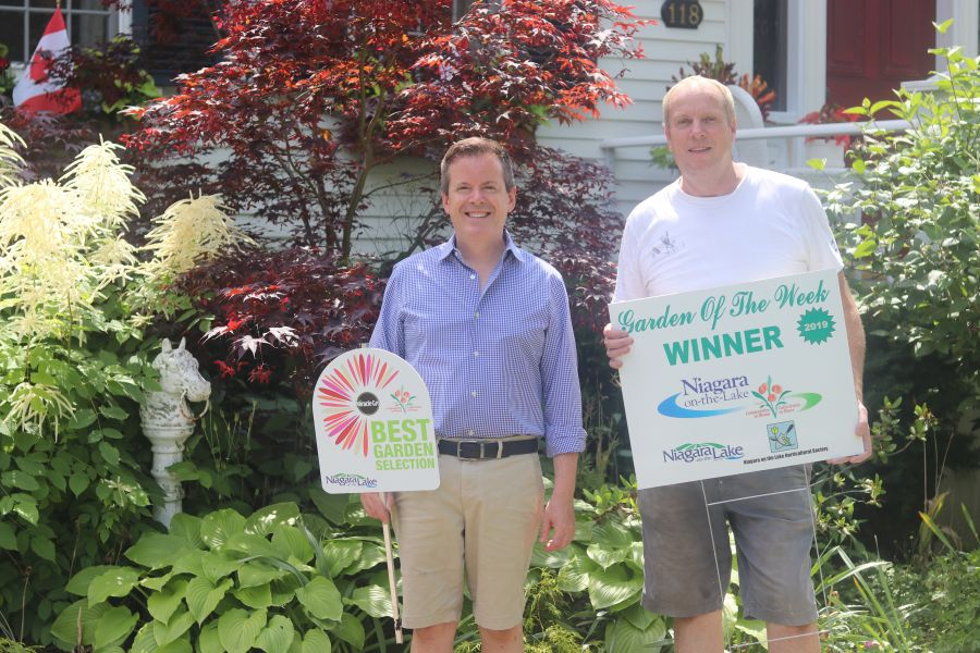 Paul_Evans_and_Scott_Langill_the_latest_winners_of_the_Garden_of_the_Week_contest_for_their_garden_on_Johnson_Street._Dariya_Baiguzhiyeva
