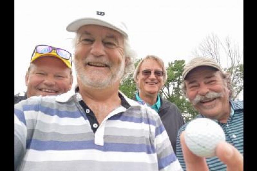 Stephen_Warboys_holds_the_ball_that_found_the_hole_for_an_an_ace_last_week.__With_him_are_playing_partners_Kurt_Hamm,_Harry_Huizer_and_Jim_McMacken._(Supplied)