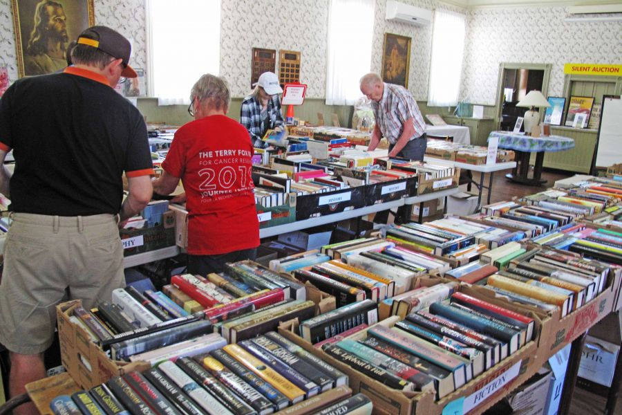 VolunteersNorm_and_Donna_Seymour_sort_throughthousands_of_books_at_the_last_Festival_Book_Sale_at_Grace_United_Church._This_year_promises_to_have_even_more._Supplied_copy